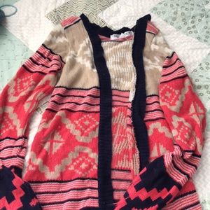 Longer cardigan, covers butt